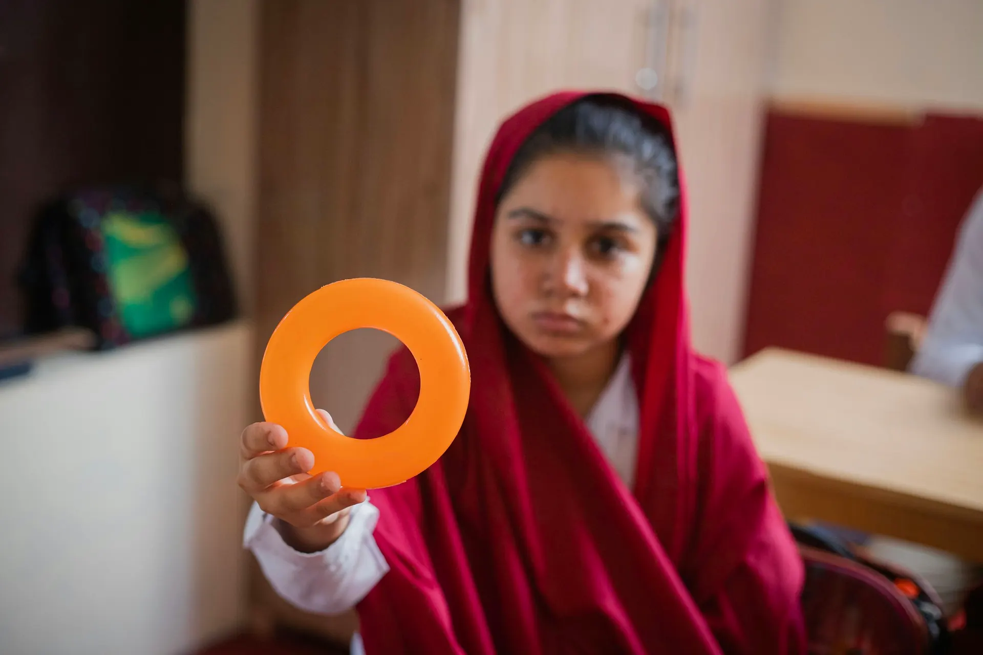 Student taking part in a hands-on classroom activity